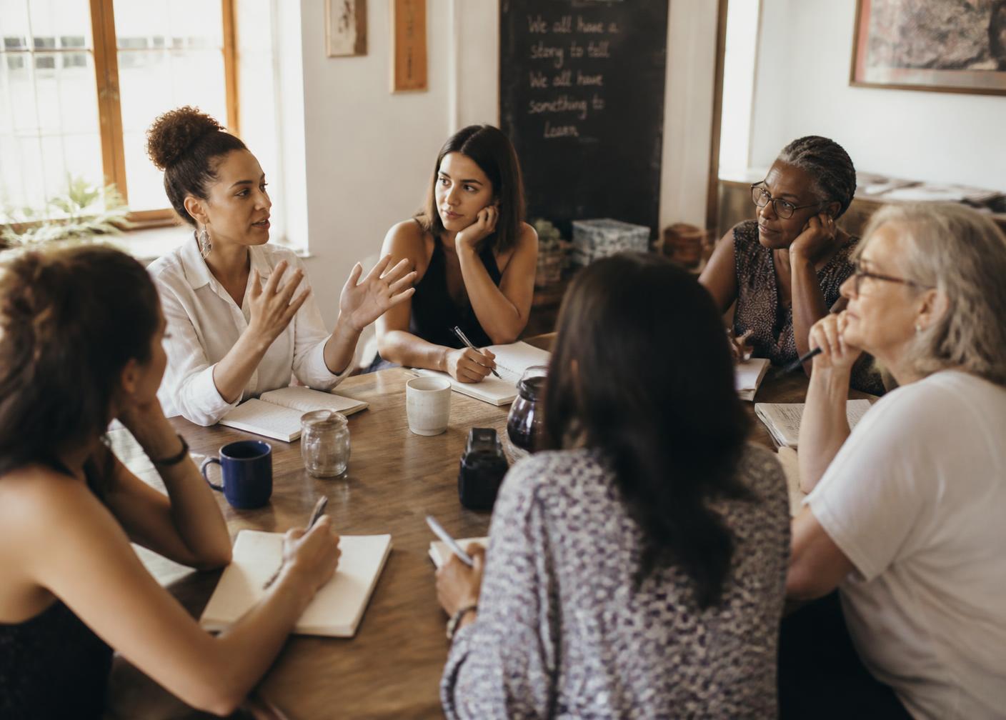 Women gathered around a table at a hands-on Alloy workshop